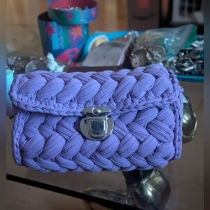 handmade purple crochet clutch bag made from t-shirt yarn with silver-tone clasp